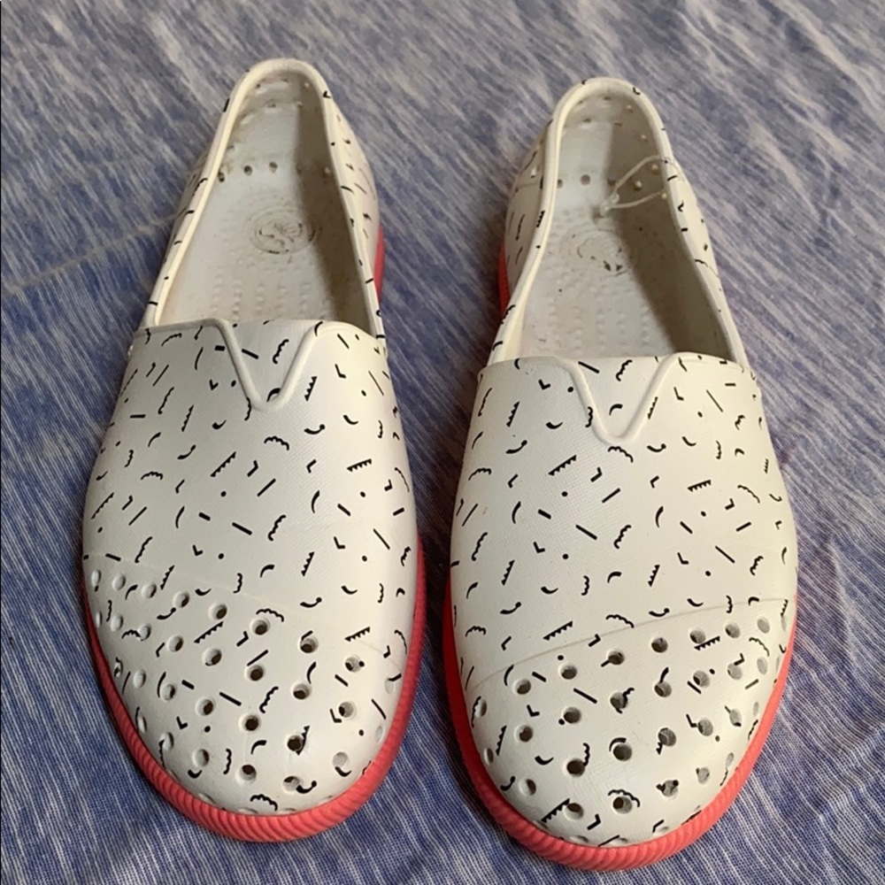 White and pink native slip ons